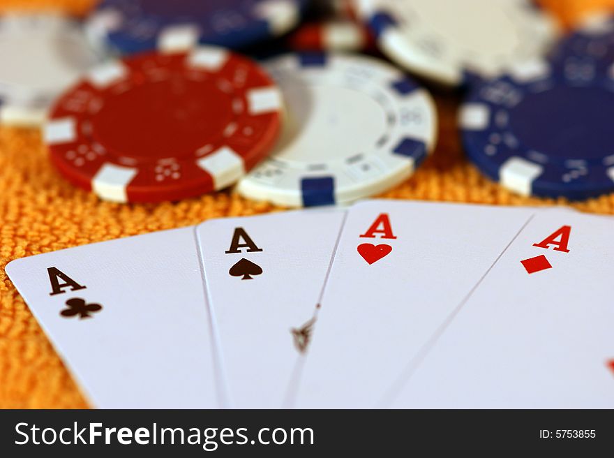 Cards and chips to play on a orange background. Cards and chips to play on a orange background.