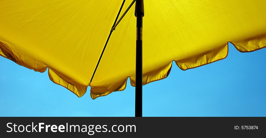 Umbrellas, Sun screen against blue sky