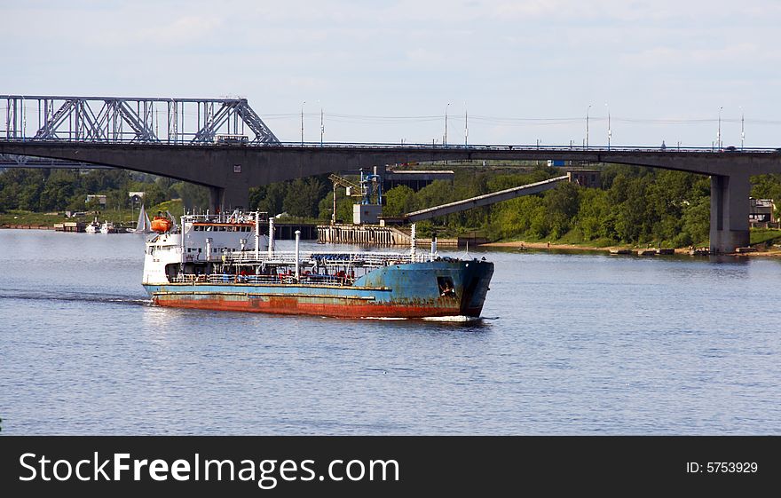 The barge with cargo on the river