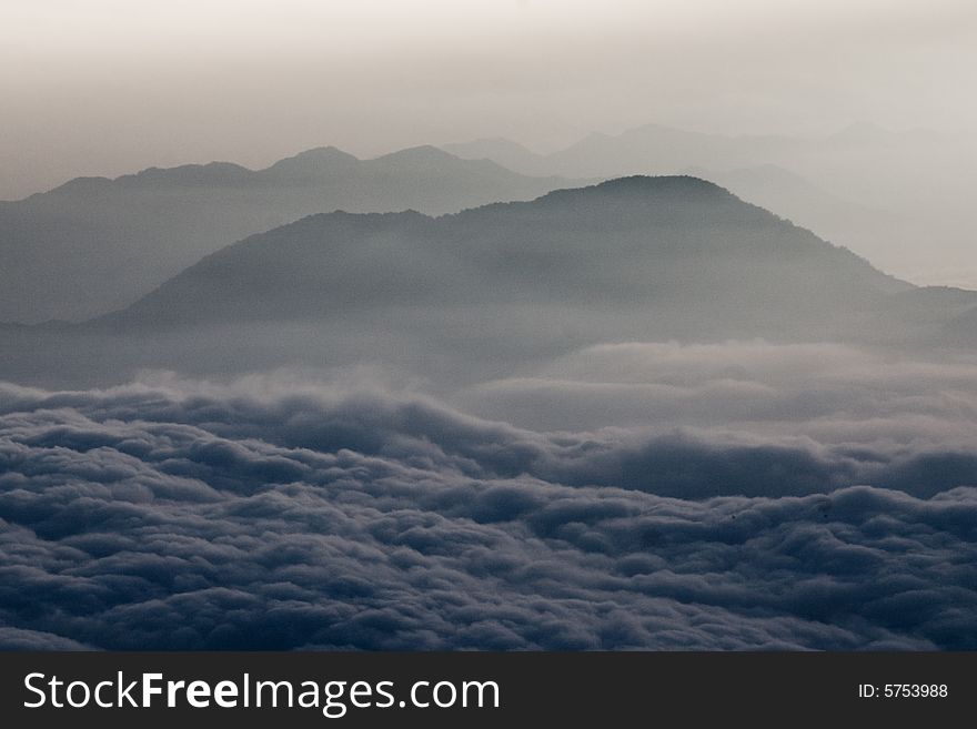 A photo taken from Mt Fuji showing mountains and clouds. A photo taken from Mt Fuji showing mountains and clouds.