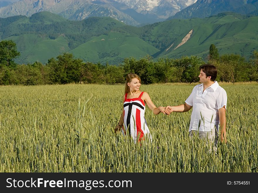 Young couple in a field of wheat. Young couple in a field of wheat