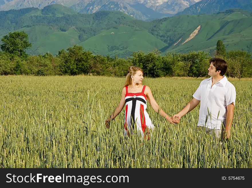 Young couple in a field of wheat. Young couple in a field of wheat