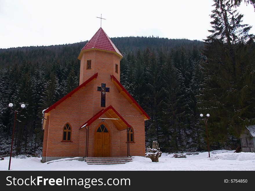 Small chapel in a snow covered wood. Small chapel in a snow covered wood