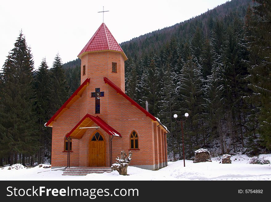 Small chapel in a snow covered wood. Small chapel in a snow covered wood