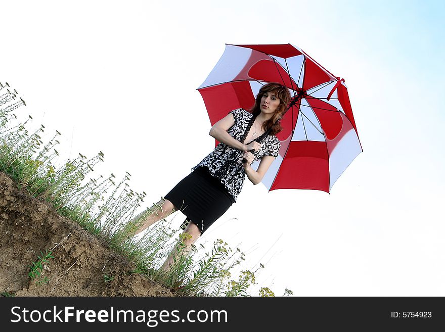 A beautiful girl and an umbrella. A beautiful girl and an umbrella