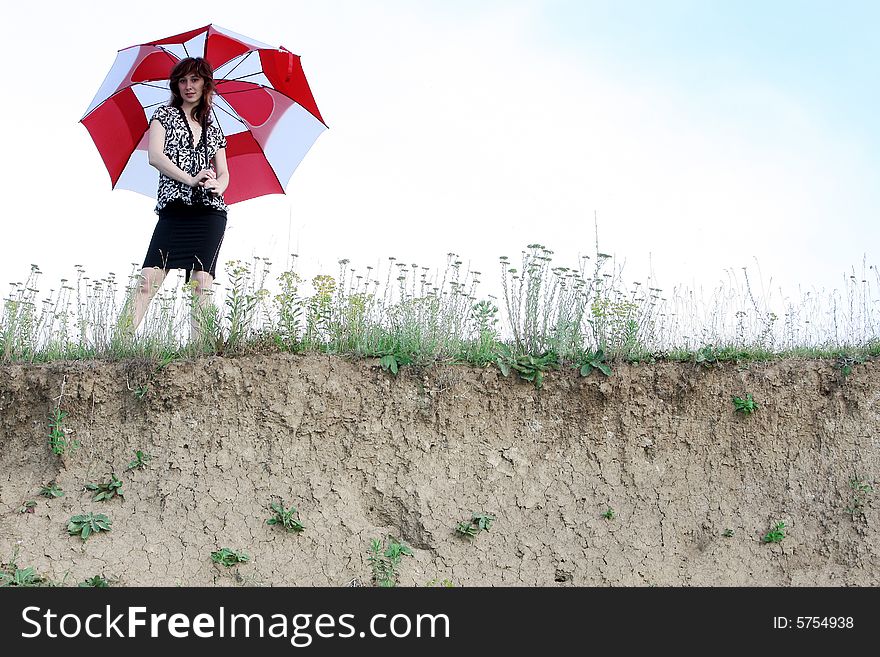 A beautiful girl and an umbrella. A beautiful girl and an umbrella