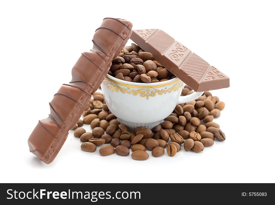 Coffee beans and chocolate in the cup on a white background. Coffee beans and chocolate in the cup on a white background