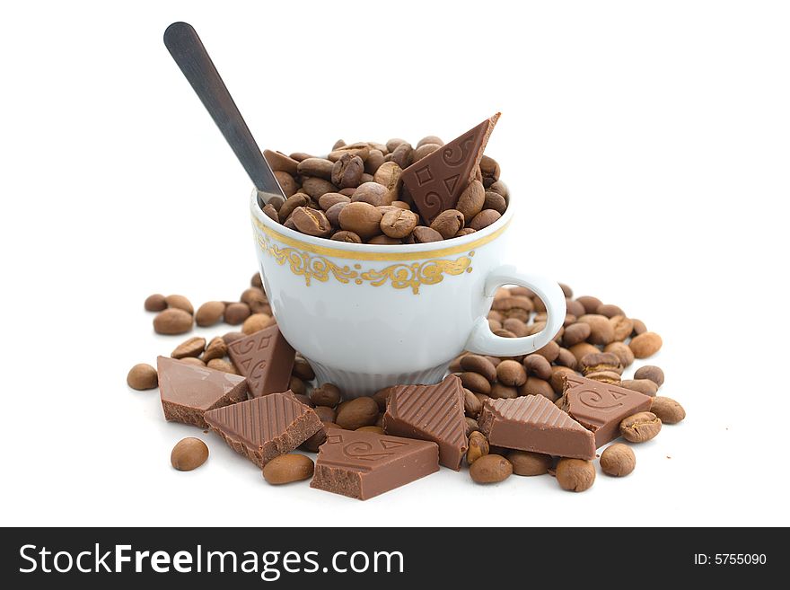 Coffee beans and chocolate in the cup on a white background. Coffee beans and chocolate in the cup on a white background