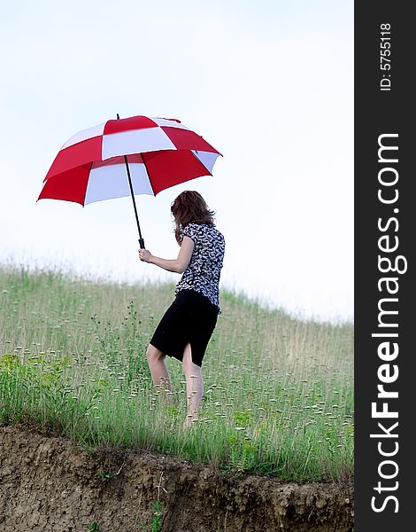 A beautiful girl and an umbrella. A beautiful girl and an umbrella