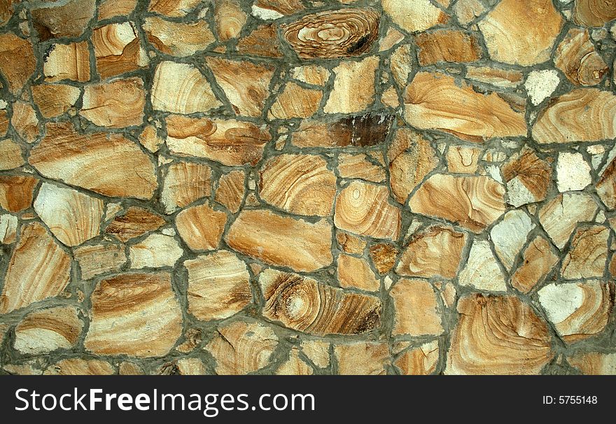 Structure of a wall reveted by a natural stone. Structure of a wall reveted by a natural stone