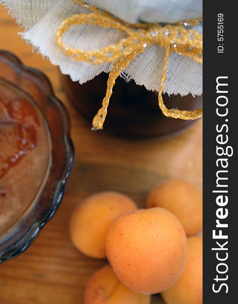 Apricot jam of house preparation on a wooden table