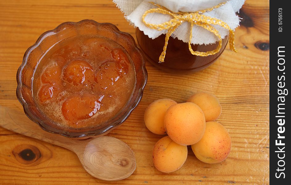 Apricot jam of house preparation on a wooden table