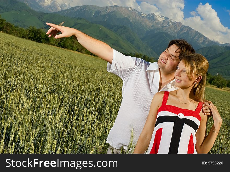 Young married couple in a wheat field. Young married couple in a wheat field