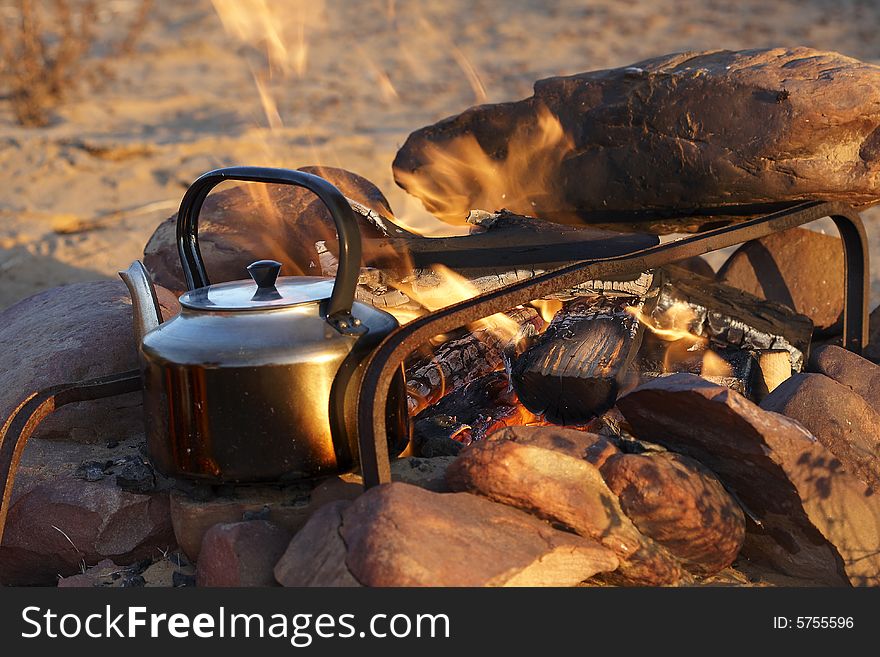 Coffee on an open fire protected by rocks. Coffee on an open fire protected by rocks