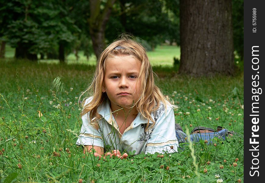 Child Lying In Grass