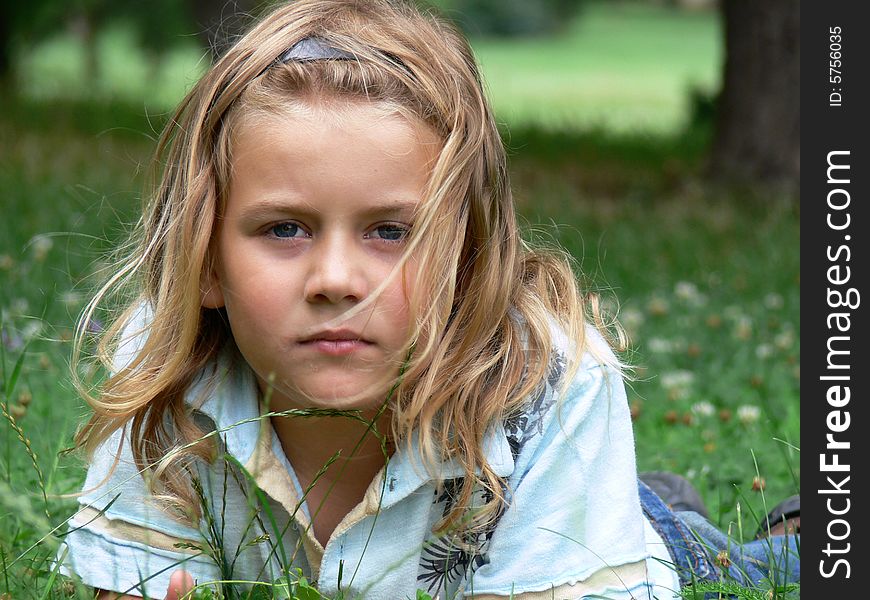 Child lying in grass