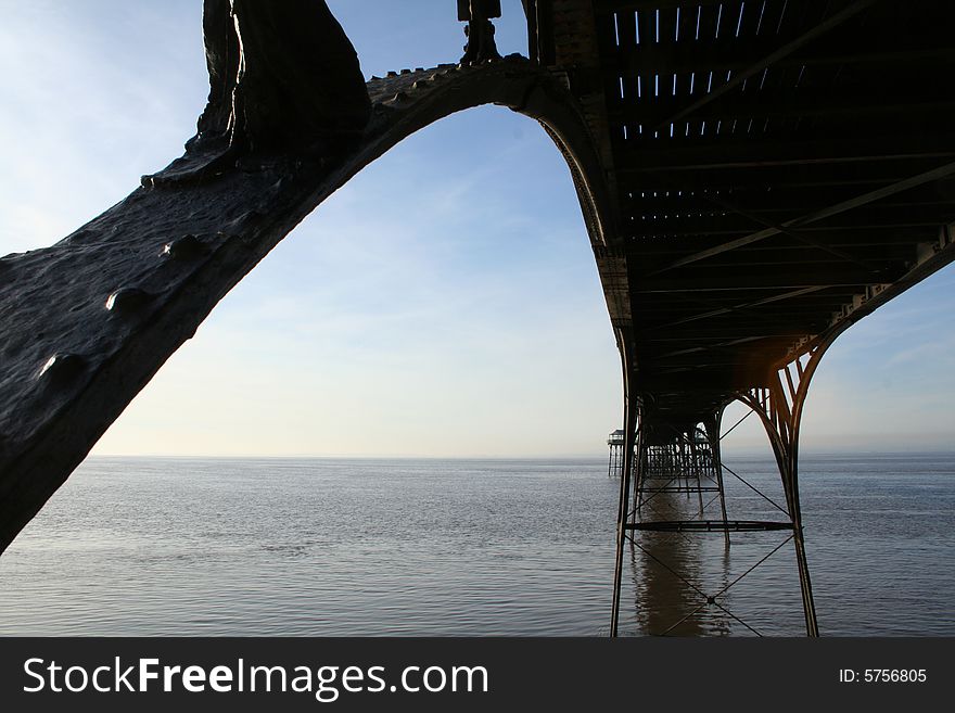 Awesome victorian pier structure from below.