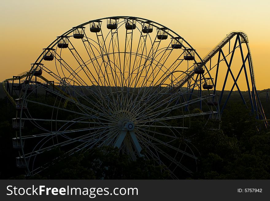 Ferris wheel at sunset in a theme park