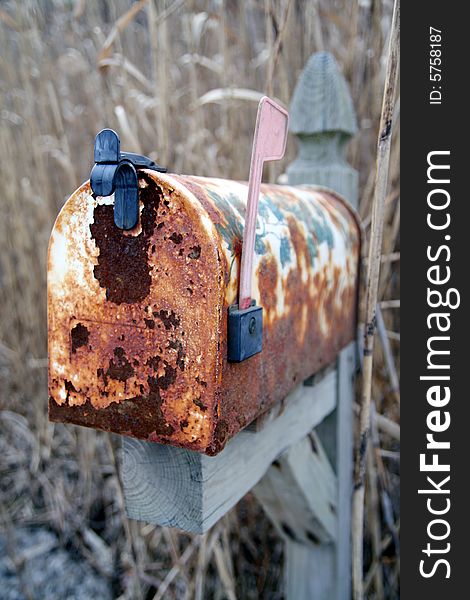Rusted Mail Box in an abandoned landscape