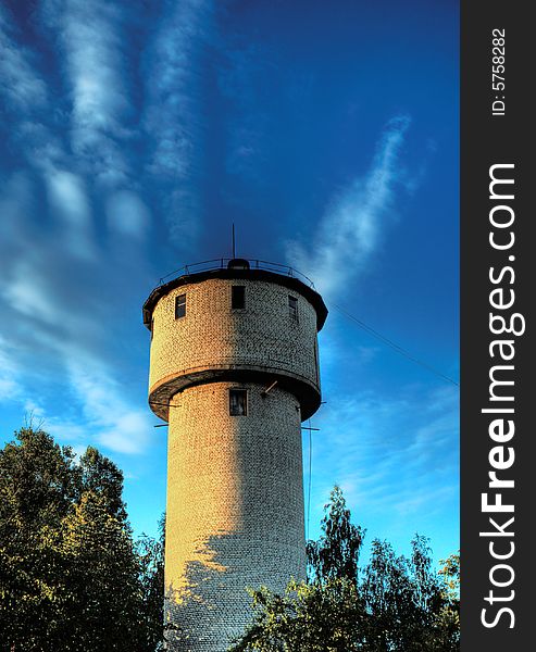 Water tower against a backdrop of blue sky