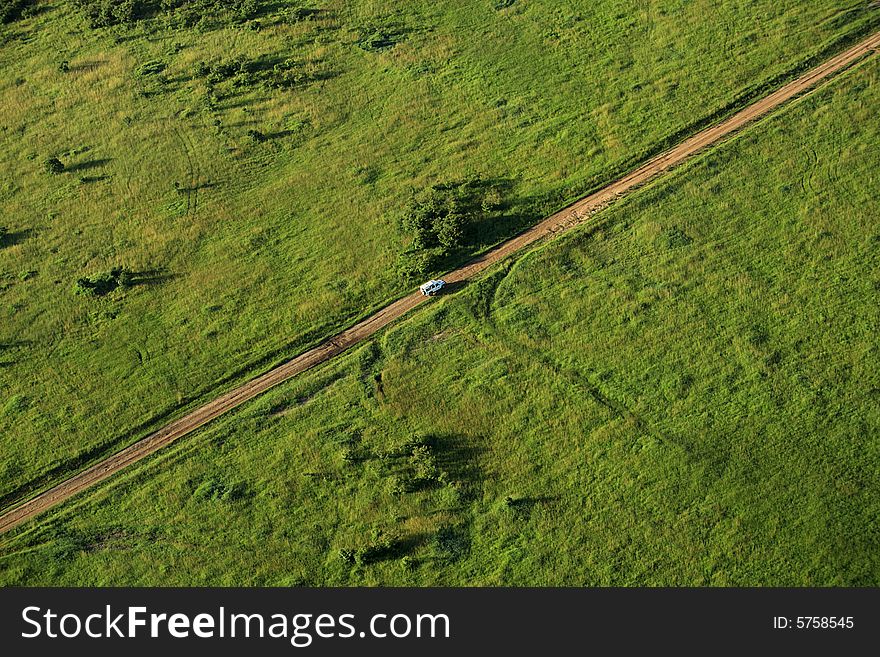 Van travelling across the Masai Mara