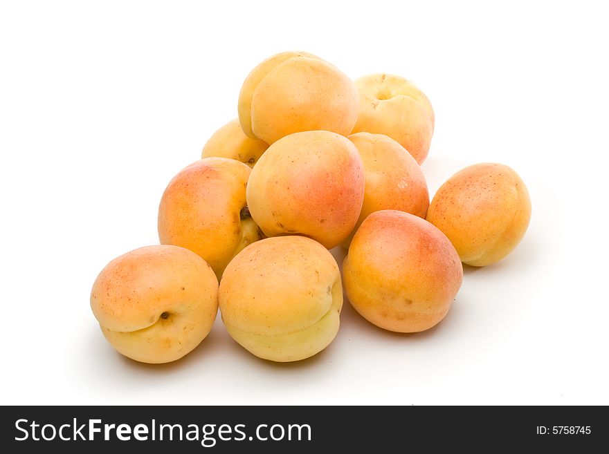 Fresh appetizing apricots on a white background. Fresh appetizing apricots on a white background