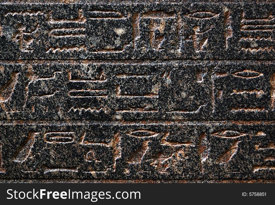 Ancient egyptian hieroglyphs engraved in stone