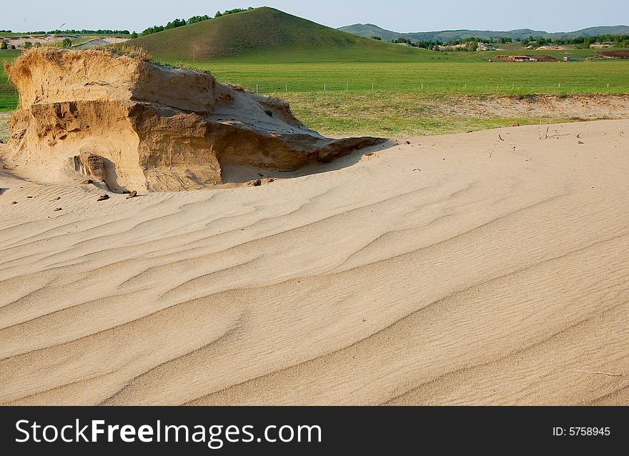 Not far from grassland is desert,Inner Mongolia. Not far from grassland is desert,Inner Mongolia