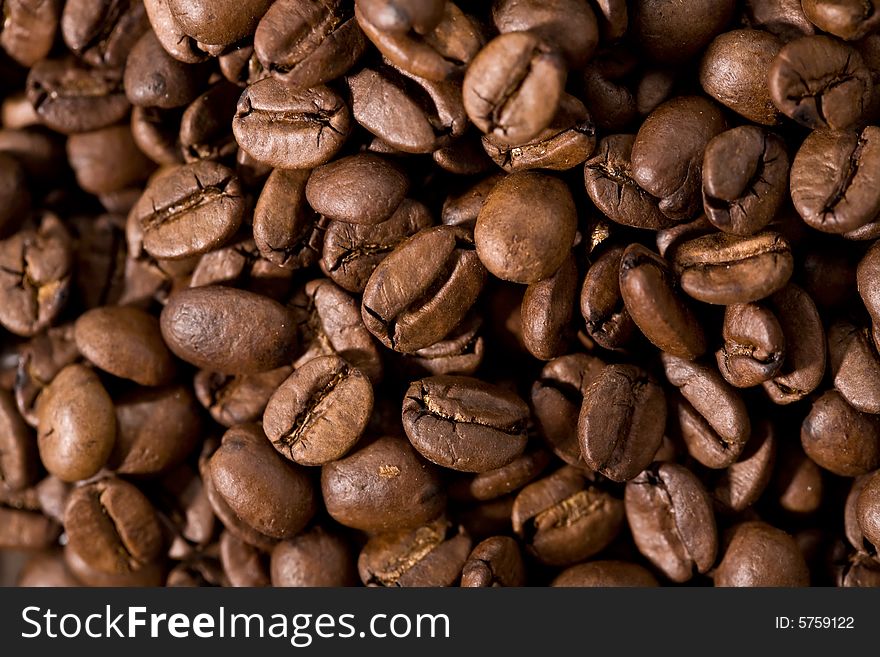 Roasted coffee beans closeup background. Roasted coffee beans closeup background