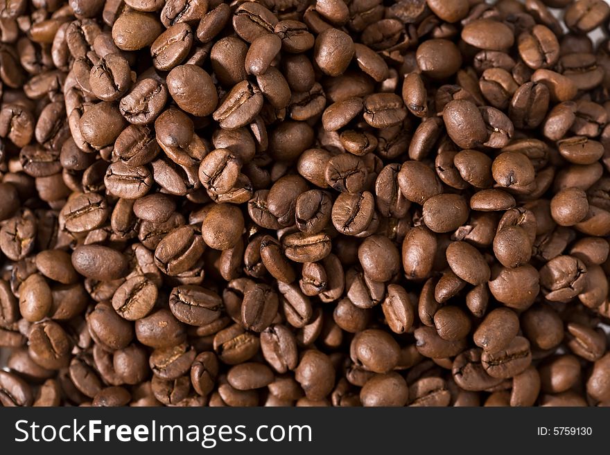 Roasted coffee beans closeup background. Roasted coffee beans closeup background