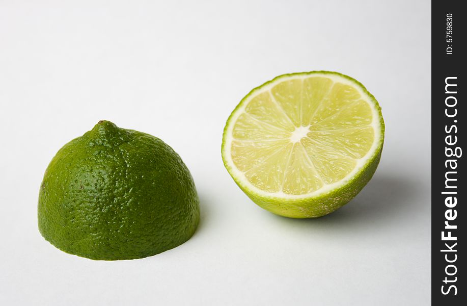 Limes halves on a white background.