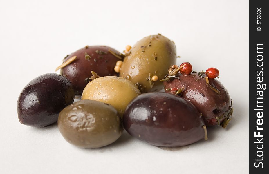 Mixed olives on a white background. Mixed olives on a white background.