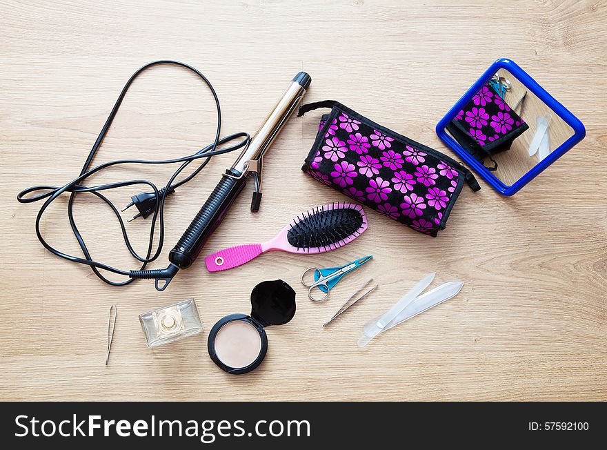 Set of female accessories of several items on the floor