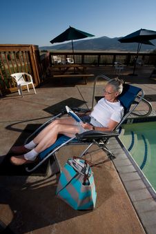Senior Woman Sitting By Pool Royalty Free Stock Photography Senior Woman Sitting By Pool Royalty Free Stock Photography