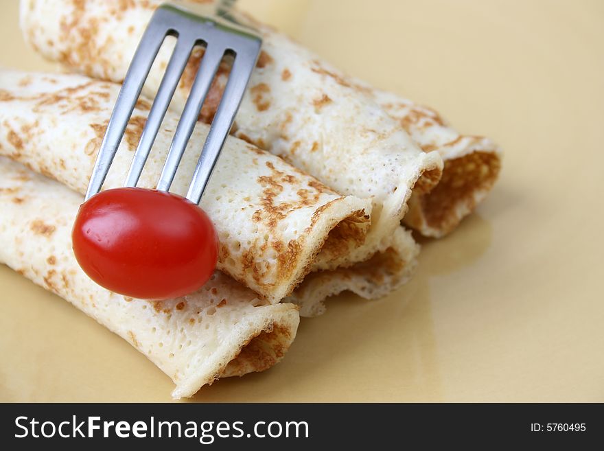 Close up of pancakes on a yellow plate. Close up of pancakes on a yellow plate