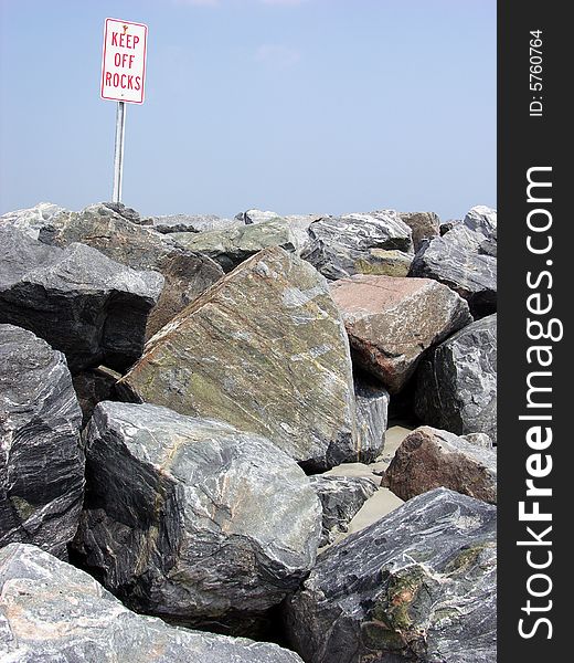 The rock warning sign on Port Canaveral beach in Florida.