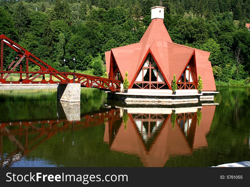 A house on a lake in the wood of transilvania. A house on a lake in the wood of transilvania.