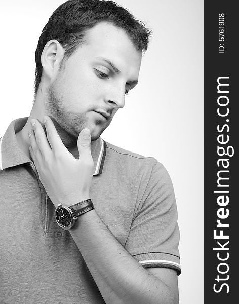 Portrait of young fellow dressed in a grey sport shirt. Portrait of young fellow dressed in a grey sport shirt