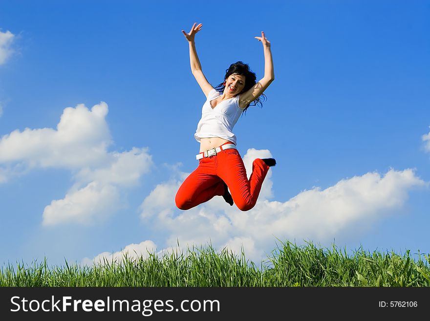 Pretty young woman is jumping