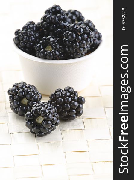 Fresh picked organic blackberries in a recyclable bowl. Fresh picked organic blackberries in a recyclable bowl.