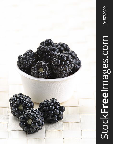 Fresh picked organic blackberries in a recyclable bowl. Fresh picked organic blackberries in a recyclable bowl.