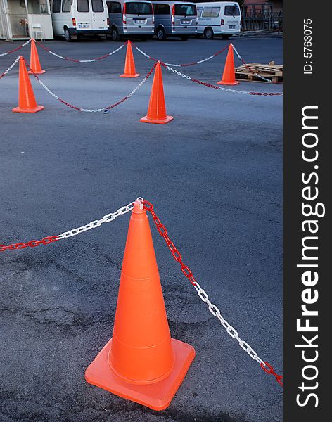 Red traffic cones on the asphalt
