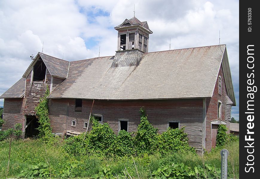 A beautiful old barn still being partially used.