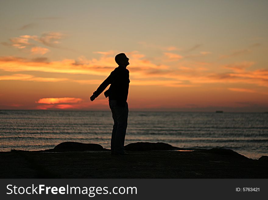 Silhouette of the girl on a background of a decline