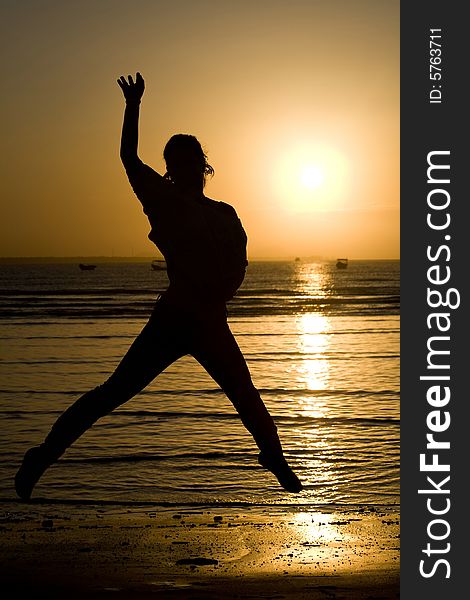 A silhouette of a girl jumping. A silhouette of a girl jumping.