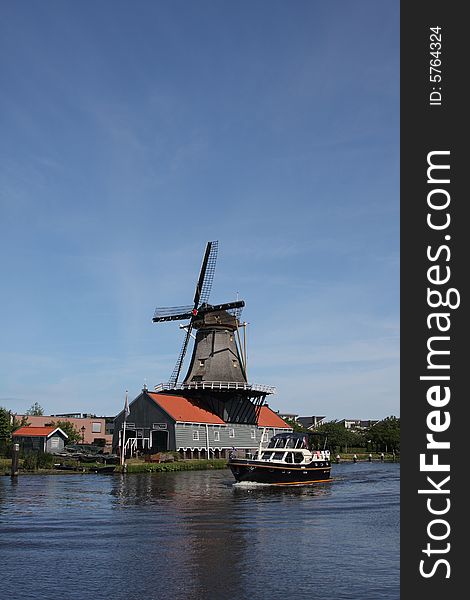 Windmill in the Hague on a canal