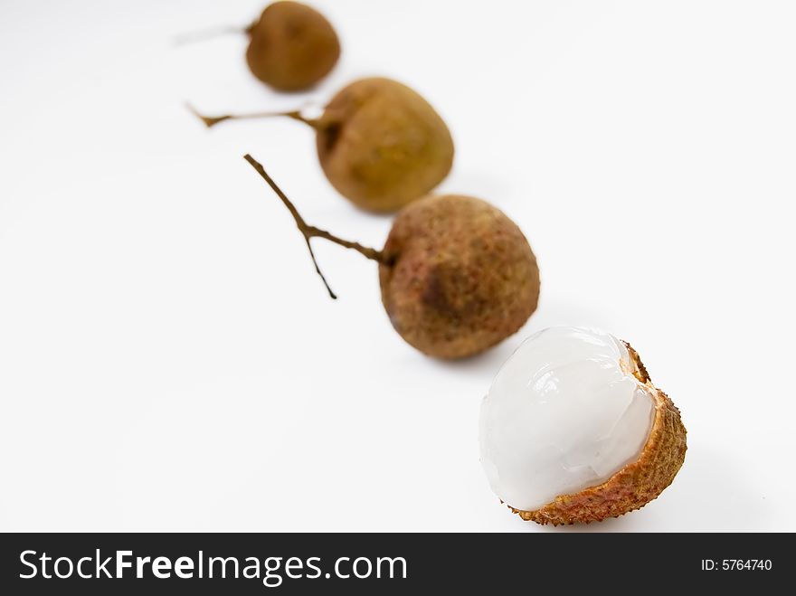 Line of Lychees on white background