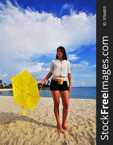 Girl on the beach with an umbrella. Girl on the beach with an umbrella
