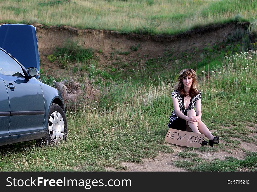 A beautiful girl waiting the car. A beautiful girl waiting the car