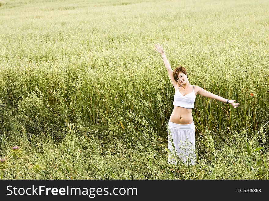 Woman feeling freedom in a field. Woman feeling freedom in a field.